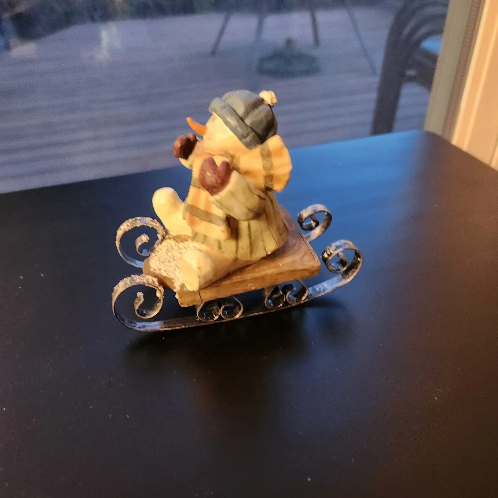 Sledding Snowman Figurine